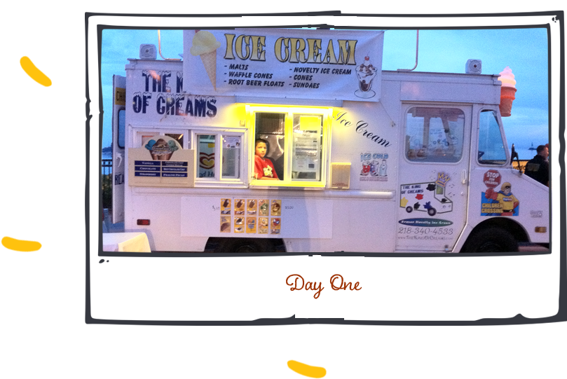 Courtland applying vinyl graphics to the Hermantown store window, highlighting branding and expansion.